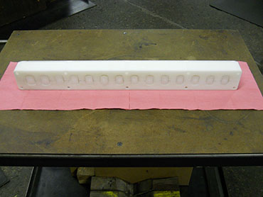 MACHINED PLASTIC DIE WITH MATCHING PLUGS (FRONT VIEW).JPG