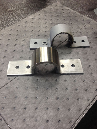 STAINLESS STEEL BRACKET OLD VS. NEW.JPG